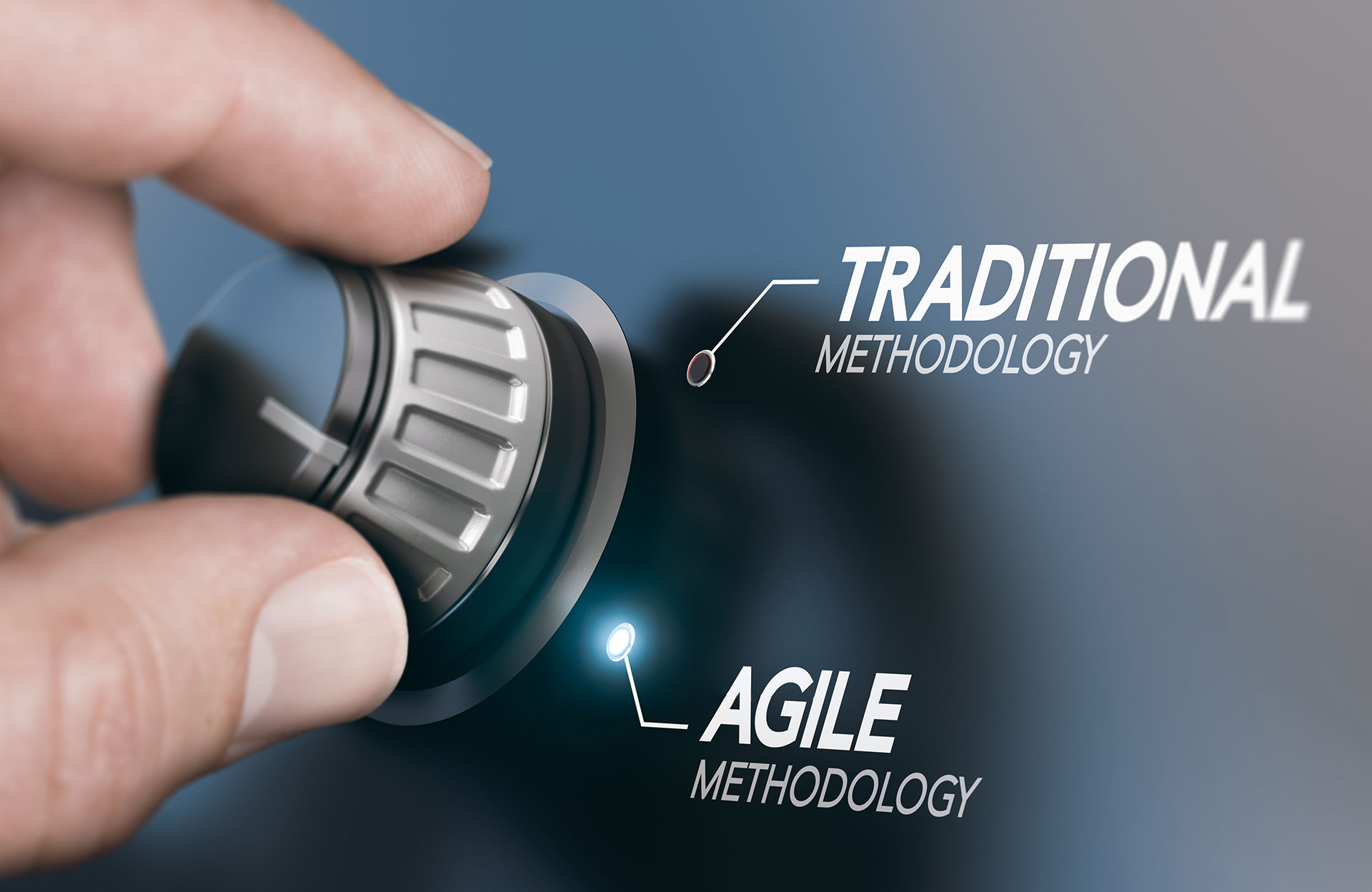 Hand turning a dial from traditional to agile methodology