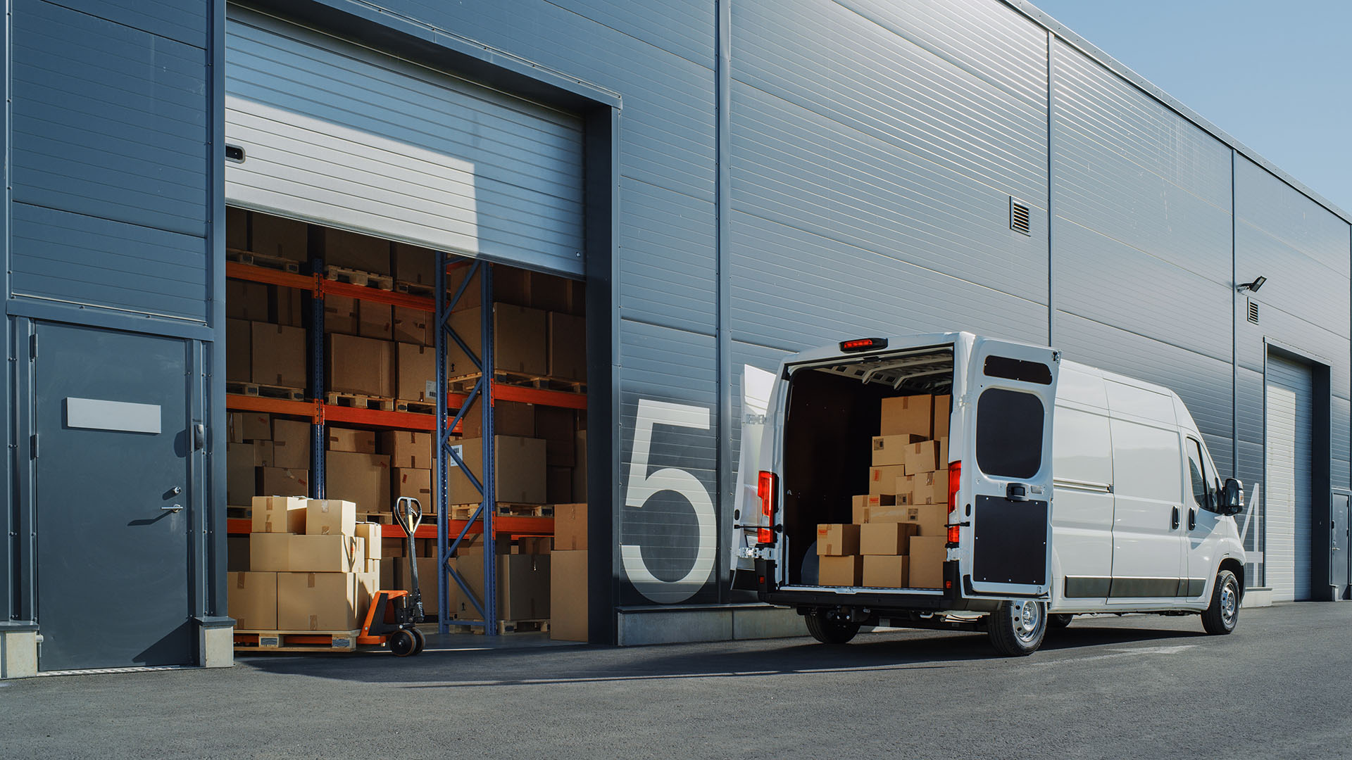 Delivery van being loaded at a warehouse